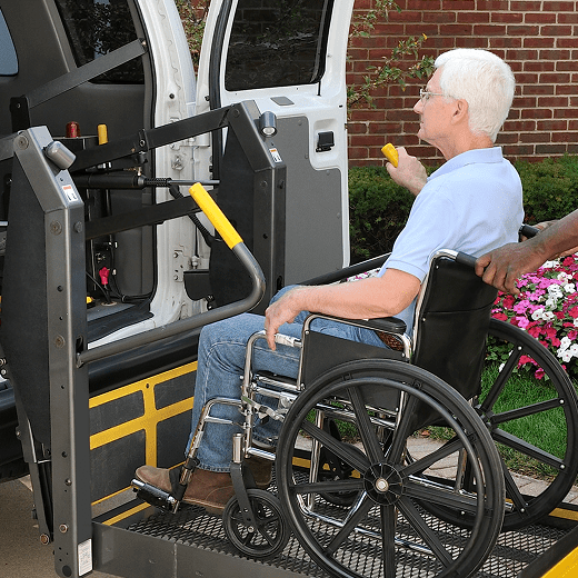 Elderly man using wheelchair lift